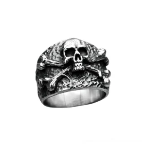 Skull crossbones stainless steel gothic ring front three-quarter view with hammered texture and aged silver finish
