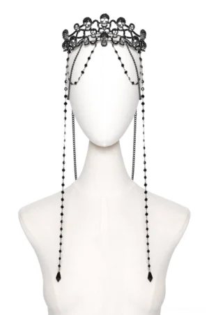 Black gothic skull crown headpiece with rhinestone-studded chains, front studio view on mannequin showing intricate skull carvings and dangling chain details