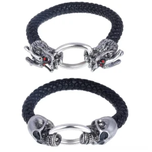 Two gothic skull and dragon head leather bracelets displayed flat lay with silver metal clasps and black woven leather bands