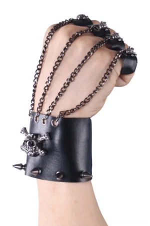 Gothic fingerless gloves worn on clenched hand showing chain link details and spike studs