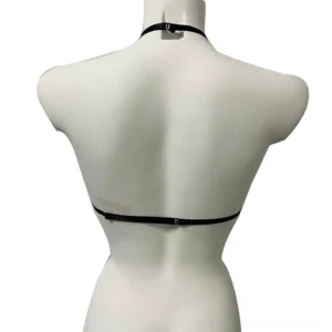 Rear view of gothic skull chest harness bra displaying adjustable back waist strap and neck fastening strap system