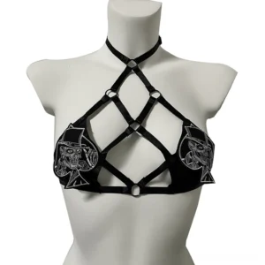 Black gothic strappy halter harness bra with silver skull gentleman embroidery and metal ring hardware, front view on mannequin