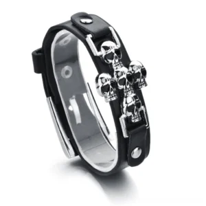 Silver skull metal embellished black leather gothic bracelet front oblique view on white background