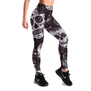 Women's black and white skull print gothic leggings with high-waist design and intricate floral patterns, front close-up detail view