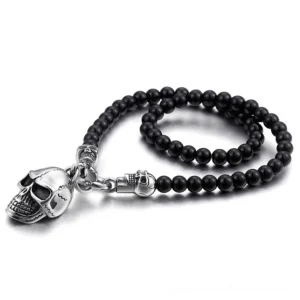 Black and gray gothic skull bead chain necklace with stainless steel pendant, flat lay overhead view on white background