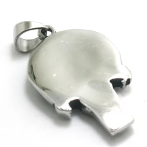 Memento mori skull necklace pendant back view displaying smooth solid silver reverse surface and secure bail attachment