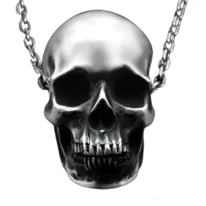 Antique silver skull pendant necklace close-up frontal view showcasing realistic anatomical bone carving and gothic jewelry craftsmanship