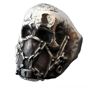 Silver stainless steel gothic skull ring with chain mouth mask lock detail, three-quarter front view