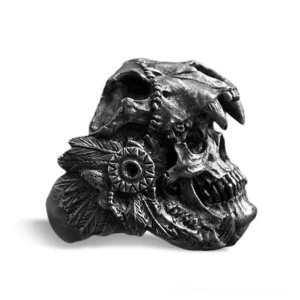 Gothic skull ring with dreamcatcher carving and tribal details, vintage black metal finish, side three-quarter angle