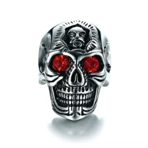 Memento mori skull ring direct front view, vintage silver tone with blood-red crystal eyes, engraved skull face detail