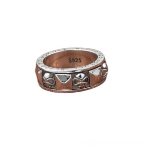 Gothic skull spinner ring front view displaying S925 hallmark, skull design and pyramid accents on plain background