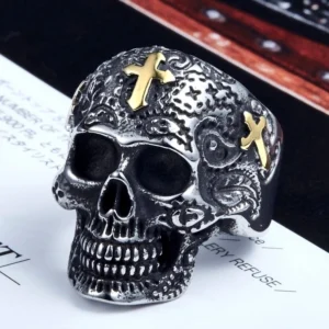Antique sugar skull biker ring with engraved flowers and cross motifs, distressed silver finish, direct front view jewelry display