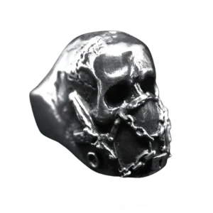 Detailed side view of gothic skull biker ring showing intricate chain wrapped mouth design and lock ornament