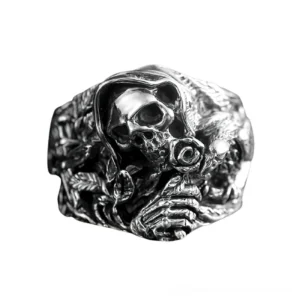 Grim reaper skull gothic ring side profile showcasing skeletal hand carved details and floral engravings on band