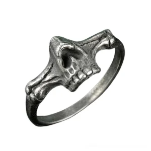 Gothic half-skull bone ring side oblique perspective displaying sculptural band design and dimensional skeleton features