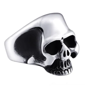 Silver polished stainless steel skull ring, side three-quarter view showcasing high shine finish
