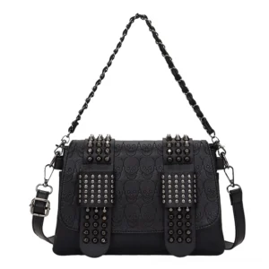 Gothic skull rivet crossbody bag front view - embossed leather with metal rivet details and dual carrying straps