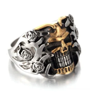 Gothic skull rose ring dual-tone silver and gold front view showing intricate skeleton jaw carving and floral details