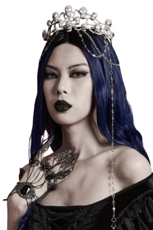Gothic skull tiara with cascading crystal chains worn by dark-haired model in front view against white studio backdrop