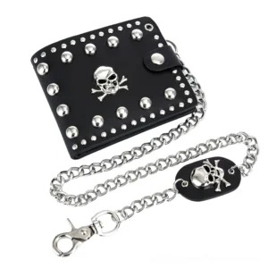 Black gothic skull rivet wallet with detachable silver curb chain and skull leather tag, shot at oblique overhead angle