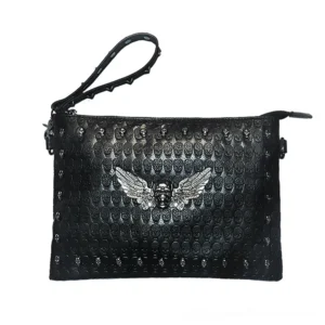 Black gothic shoulder bag with ornate metal skull-wing decoration and embossed skull patterns, front flat view