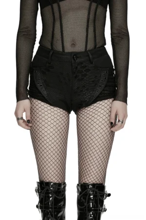 Black snake-print gothic low-rise shorts with lace-up front detail worn with fishnet stockings and platform boots, front half-body studio shot