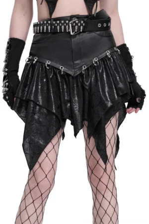 Black gothic snake print asymmetric mini skirt with metal rings on model wearing fishnet tights and fingerless gloves, front three-quarter view