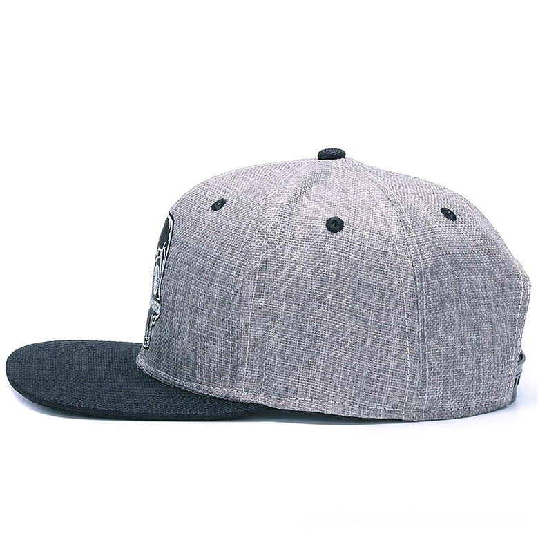 Left side view of embroidered gothic snapback baseball cap with black flat brim detail