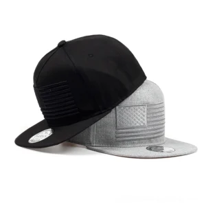 Stacked black and heather grey gothic snapback caps showing side profile and adjustable brim detail