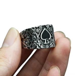 Vintage spade gothic men's ring close-up worn on finger showing aged silver finish and black inlaid spade pattern