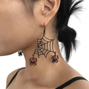 Black spider web dangle earrings with red rhinestones worn on model, gothic jewelry close-up