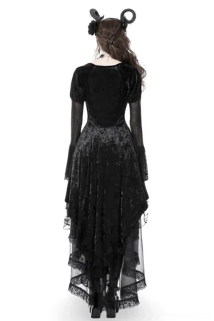 Black crushed velvet high-low dress back view showing asymmetrical layered ruffled hem and mesh bell sleeves
