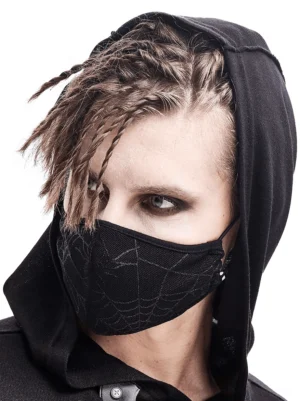 Gothic black spiderweb face mask worn by male model with braided hair in three-quarter front view against white background