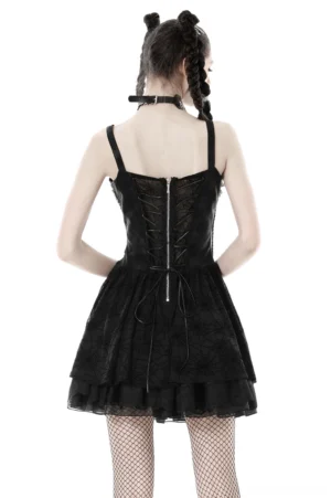Black gothic suspender dress back view showing lace-up mesh panel, zipper closure, and ruffled skirt detail
