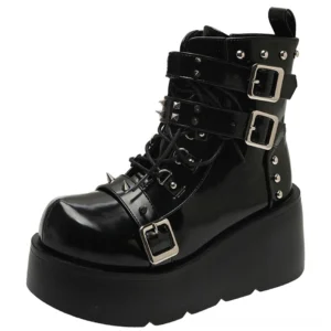 Gothic spiked platform ankle boot in black patent leather with buckles and rivets side view