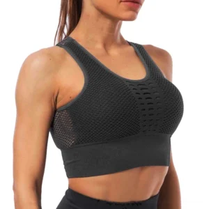 Dark gray hollow back gothic sports bra with racerback mesh design, front studio display on female fitness model