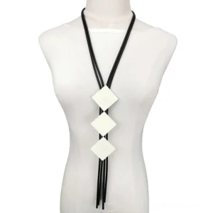Square wood pendant gothic necklace displayed on white mannequin bust, featuring three beige square wooden charms with black elastic rubber tassel cord, frontal view