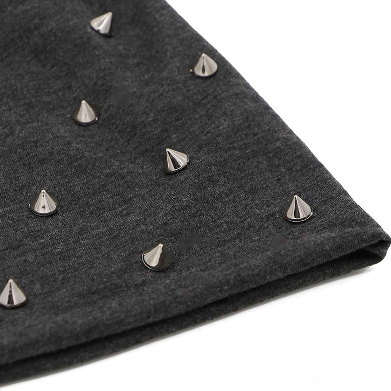 Close-up macro detail of dark gray gothic beanie fabric with silver metal cone studs texture