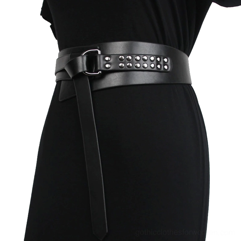 Black gothic studded leather corset belt worn on model, side waist view showing silver rivet detailing and square pin buckle