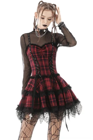 Red and black tartan gothic mini dress with studded straps and black lace trim, front three-quarter view worn by model with braided hair