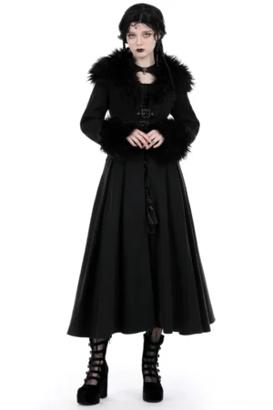 Black gothic trench coat with faux fur collar and cuffs, full front view on model wearing alternative fashion style against white studio background