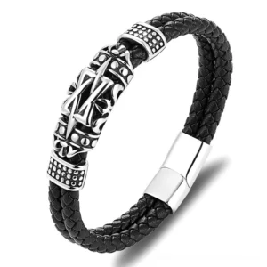 Dark tribal totem leather bracelet with carved design and stainless steel magnetic clasp, front flat lay close-up view