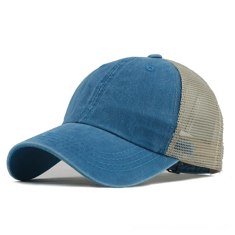 Sky blue washed gothic trucker cap with beige mesh rear and double-stitched visor, three-quarter side view