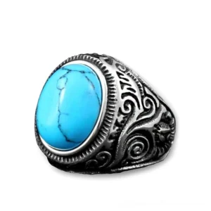 Vintage silver bezel-set gothic ring with turquoise oval stone and carved scroll motifs