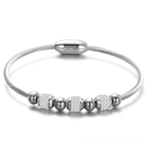 Silver tone twisted cable gothic bracelet with crystal accents, magnetic closure system, ideal for alternative dark fashion styling