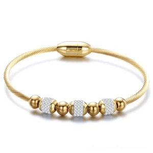 Twisted stainless steel gothic bracelet with crystal pave beads in gold finish, featuring magnetic clasp and cable chain design