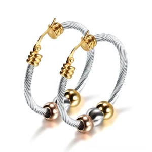 Twisted silver stainless steel gothic hoop earrings with tri-color beads, overhead flat lay view showcasing detailed twisted cable design