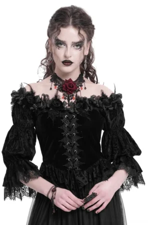 Gothic black velvet off-shoulder blouse with lace-up front, ruffled lace puff sleeves, and rose neckline details on model, front view