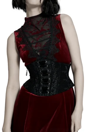 Black velvet gothic corset belt with rose lace front detail, worn by model showing lace-up construction and waist cinching effect