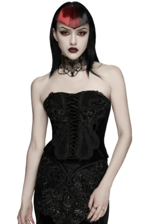 Black velvet gothic corset with 3D floral lace embroidery worn by model with red-streaked bangs, front view showing lace-up design and delicate mesh details
